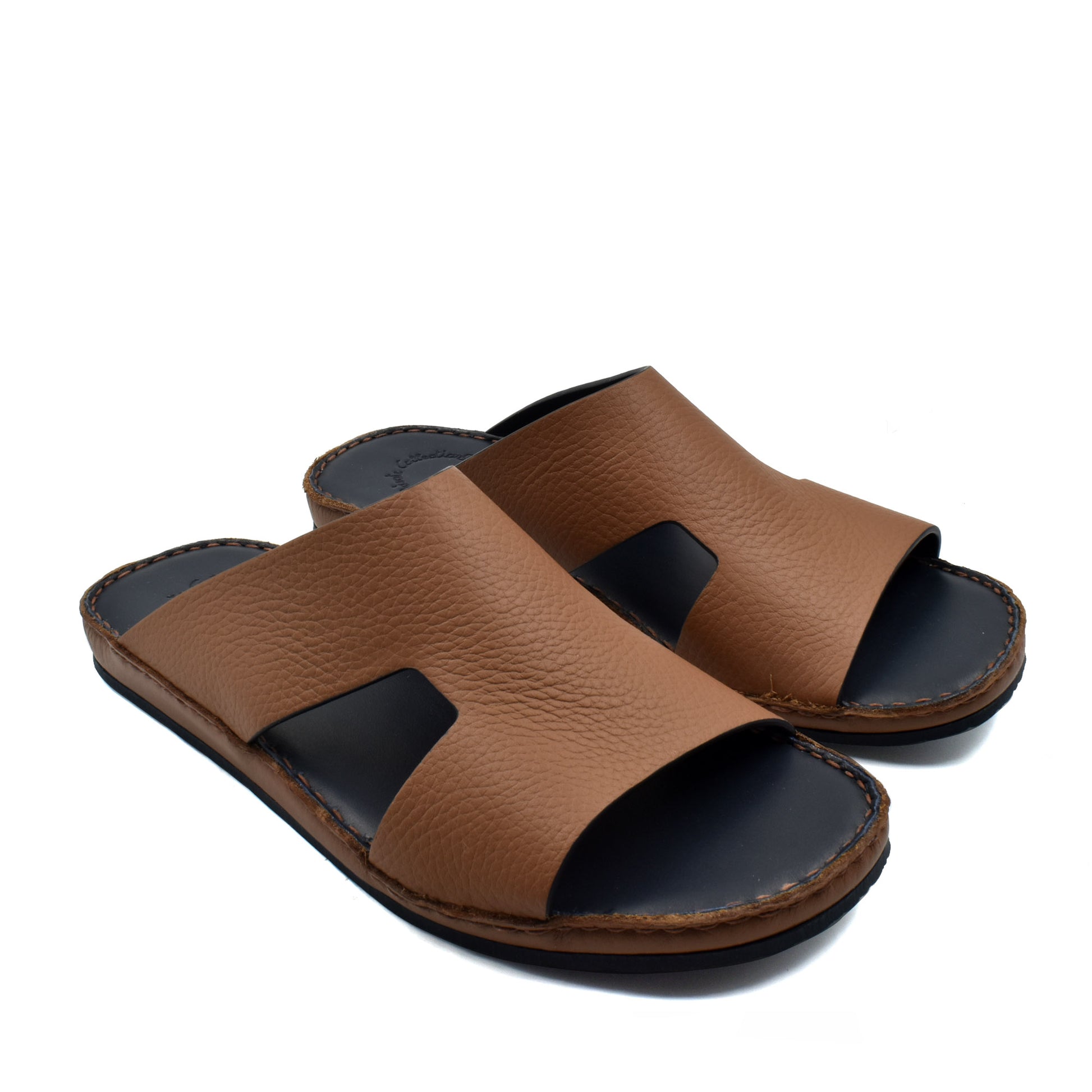 Brown Western leather sandals with open toe and black cushioned sole for comfortable wear