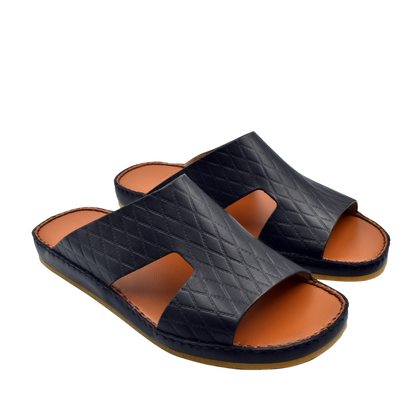 Black quilted Western style leather sandals with open toe and tan footbed for casual wear