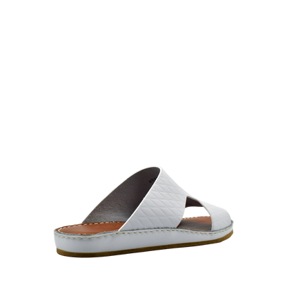 White Western style leather sandals with quilted straps and brown cushioned sole